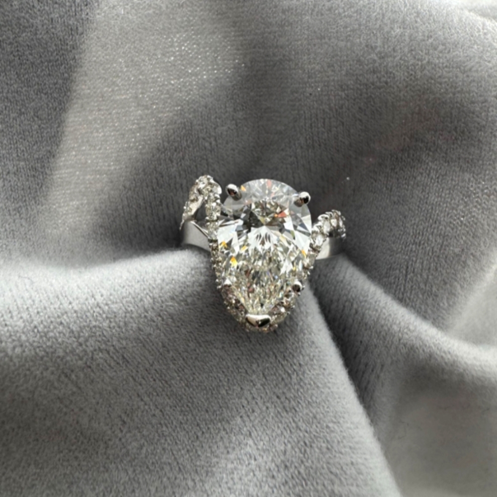 4 Ct Pear Diamond On Asymmetrical White Gold and Diamond Setting